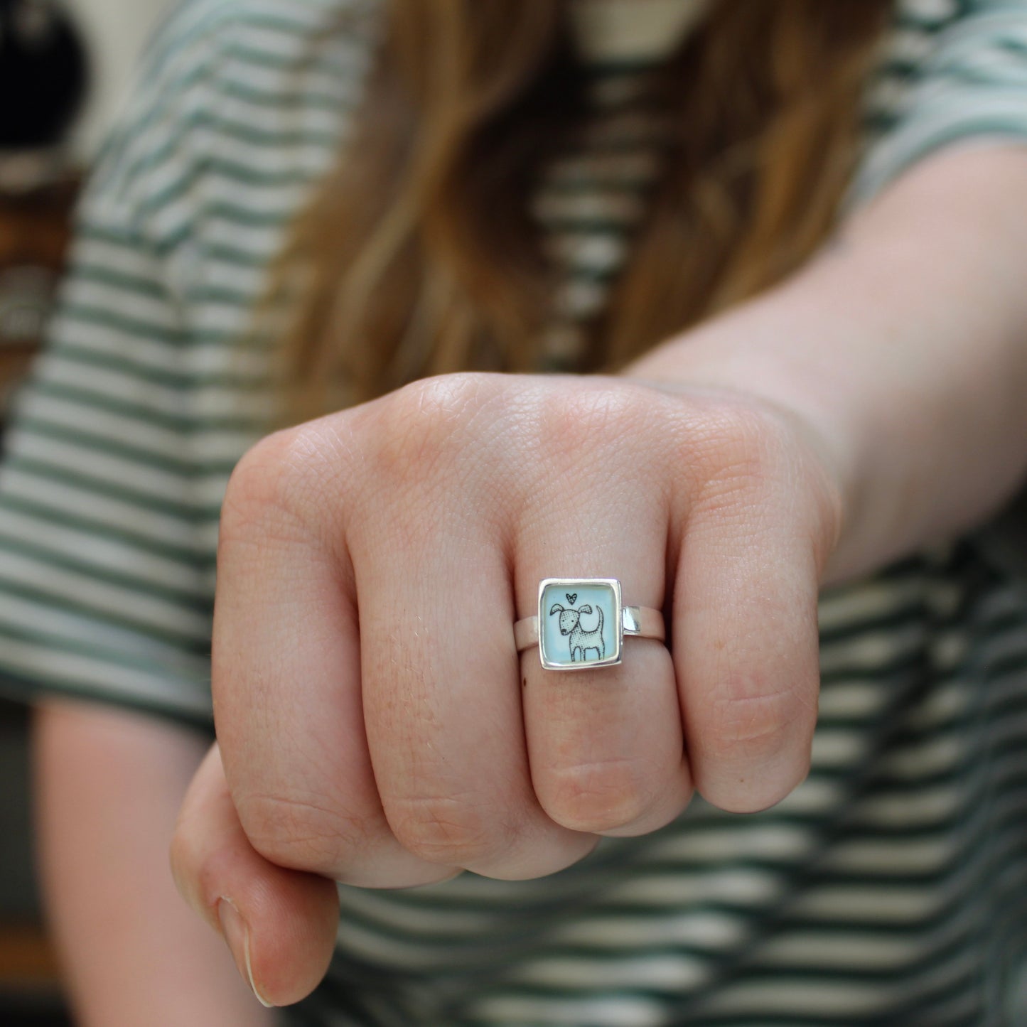 Sterling Silver and Enamel Love Dog Ring on Light Blue
