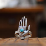 Sterling Silver Hand Ring Holding Turquoise Gemstone