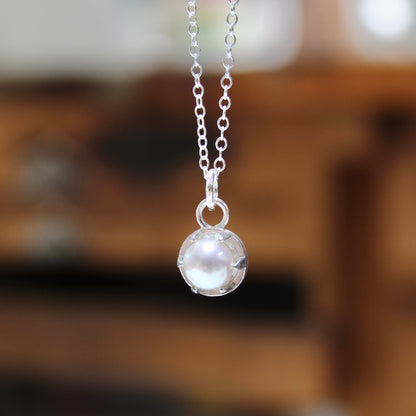 Tiny Pearl Necklace in a Sterling Silver Prong Setting