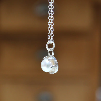Tiny Pearl Necklace in a Sterling Silver Prong Setting