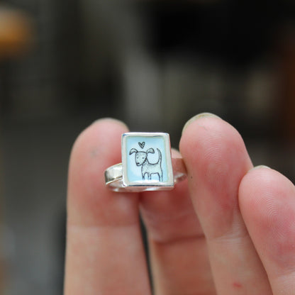 Sterling Silver and Enamel Love Dog Ring on Light Blue