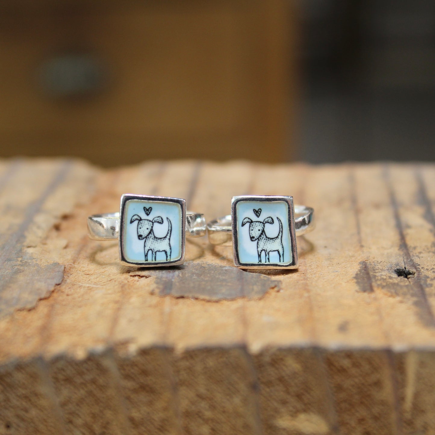 Sterling Silver and Enamel Love Dog Ring on Light Blue