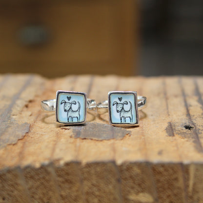 Sterling Silver and Enamel Love Dog Ring on Light Blue