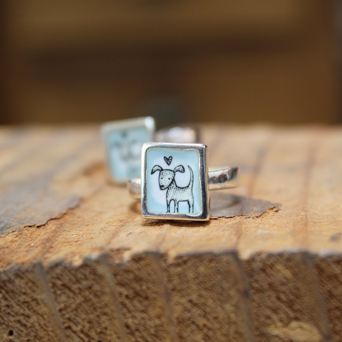 Sterling Silver and Enamel Love Dog Ring on Light Blue