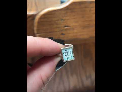 Sterling Silver and Enamel Love Dog Ring on Light Blue