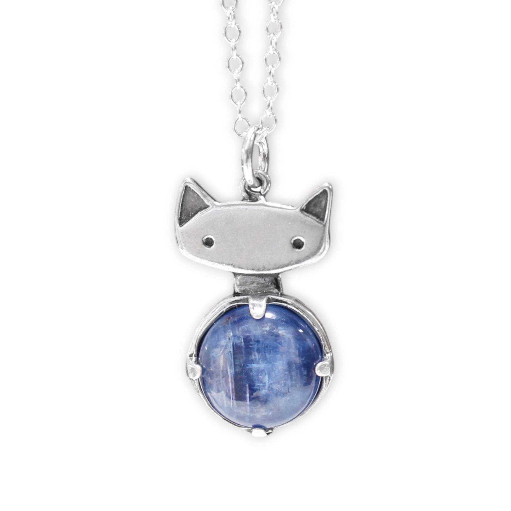 Cat-shaped pendant with blue gemstone on a white background