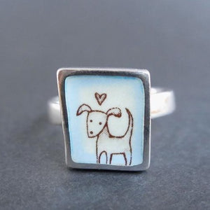 Sterling Silver and Enamel Love Dog Ring on Light Blue